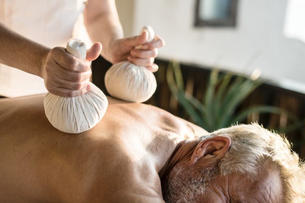 massage therapist massaging at a spa JLYQ6DB min scaled